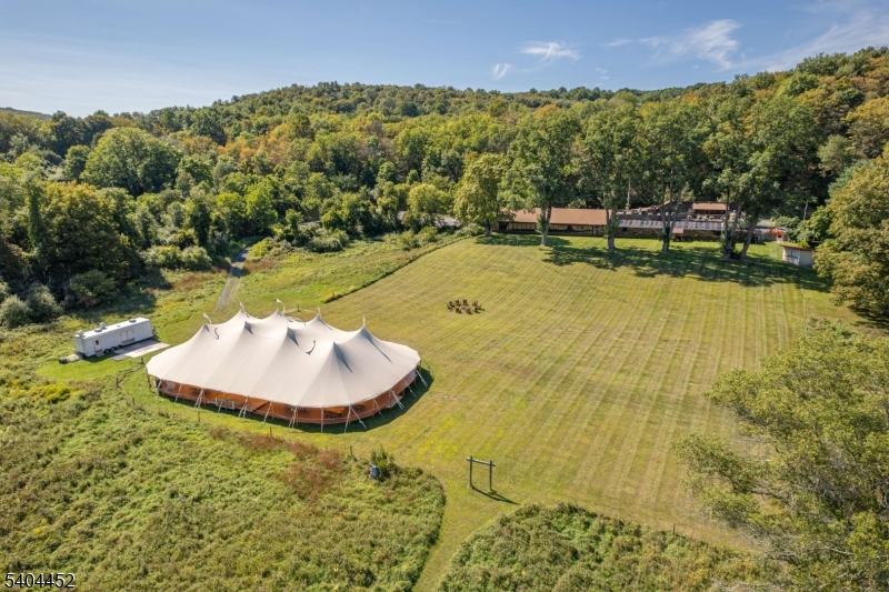 Iconic NJ Restaurant Destination for sale. Owned by the operators since 1949, the restaurant and event facility has been a dining destination for years. Large operating restaurant business and event business that has been thriving for decades. Over 1000 feet of frontage on the Flat Brook River. Surrounded by the 65,000- acre Delaware Water Gap National Recreation Area, this property is a secluded sanctuary with limitless potential. The existing structure offers ample space to build out guest rooms, creating a boutique inn, a premier corporate retreat, or a wedding venue. Open fields and beautiful views, ideal for equestrian use as well. World-class hunting, plus swimming and fishing on the adjacent Flat Brook.