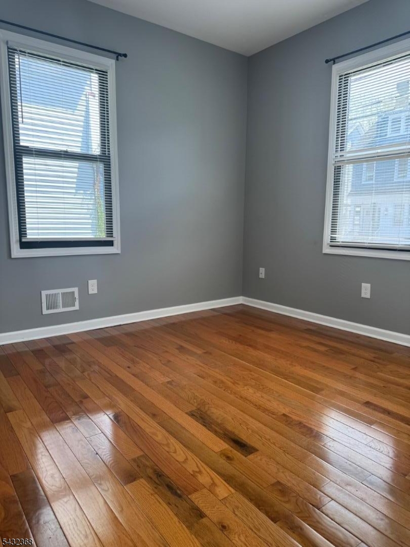 Completely renovated 2 bedroom, 1 bath apartment featuring an open concept layout, beautiful hardwood floors, recessed lighting, and high end modern finishes throughout. Stunning kitchen includes stainless steel appliances, dishwasher, granite countertops, custom cabinetry, and a center island perfect for entertaining. Spacious bedrooms and a fully updated designer bathroom complete the space. On site laundry facility available for tenant convenience. Additional storage units available for an added fee, with off street parking also available. Conveniently located near shopping, restaurants, public transportation, and major highways. Don't miss this move in ready rental opportunity!