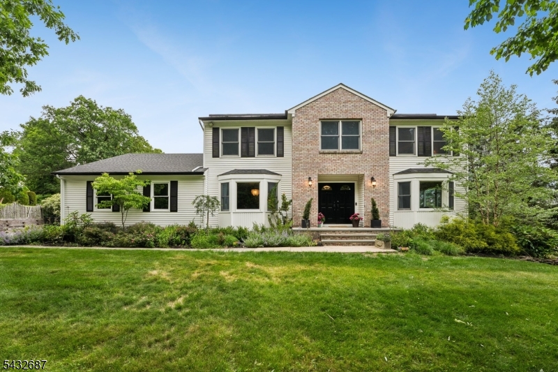 Nestled on .43 acre, surrounded by trees, "privacy, serenity, and peaceful" are what come to mind when describing this fabulous home. Charm and character are paired with modern updates that make this center-hall colonial timeless. Highlights include large, spacious rooms, updated bathrooms, Andersen windows, including 3 bay windows, a first-floor bedroom/office and laundry room, French doors from the family room to the deck, and 4 large bedrooms upstairs with ample closets. The lower-level walk-out to the backyard has a private entrance and is fully finished with a den (or 7th bedroom), a guest/maid room, a full bathroom, a massive rec room, a storage/workroom, plus loads of closets & great storage. The HUGE fenced-in backyard is perfect for baseball, soccer, or football games, and can easily accommodate a pool or playset. The 60-ft deck provides a perfect spot to enjoy AMAZING VIEWS, especially for area fireworks, BBQs, or simply a quiet spot to relax! Located near parks & recreation, easy access to major highways & many NYC commuting options.