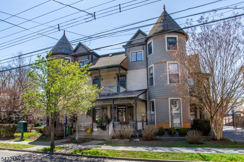 Are you looking for the ultimate weekend getaway?  Somewhere that requires little to no maintenance?  This amazing multi-level unit could be the place.   It offers stunning architecture, style and modern day ease of living.  Originally built in the late 1800's and part of the sprawling home of renowned local builder Cornelius Arnett, this tastefully designed 1700 square foot space is actually the largest of 6 unique condos artfully subdivided in 1986.  Experience the quiet of this sought after neighborhood from the comfort of the large front porch, or from a tranquil perch on the 2nd level's covered balcony.  The open floor plan blends natural light, hardwood floors, a large eat-in kitchen with center island and stained glass windows with many of today's modern amenities.  The 2nd bedroom with adjacent full bath is a great place for guests or a quiet study.  The primary suite is a private sanctuary offering a full bath, vaulted ceilings, a private office, multiple closets for storage and a designated laundry room for convenience.  This open and airy Suite even has a place to sit and read in a comfy chair looking out over the tree-lined street.  ***Parking in this part of town is always accessible***