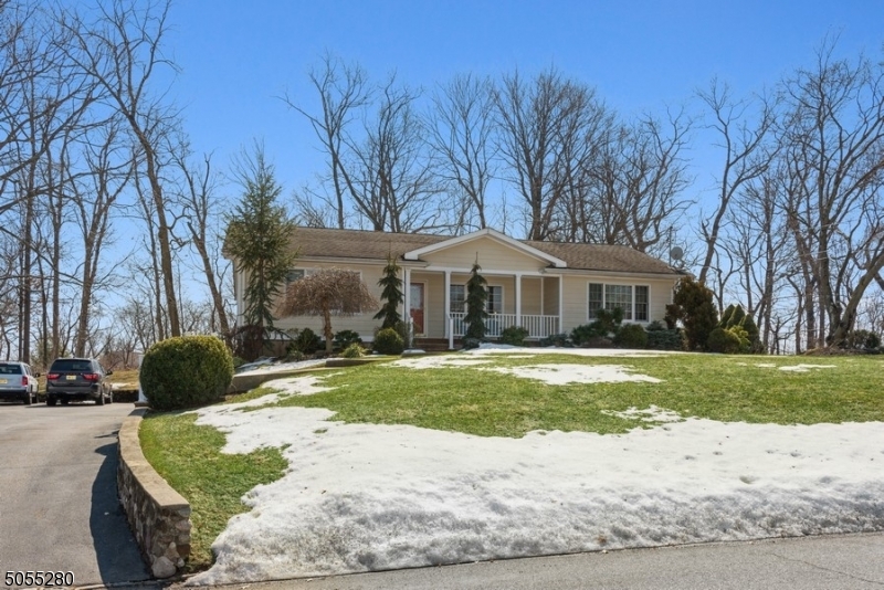 Spacious & stylishly updated Ranch w/ 3 BR & 2 baths situated on an oversized, beautifully landscaped lot near schools, stores, restaurants, major highways, & several walking & biking trails. A welcoming front porch invites you inside to a light & bright LR, extending to a FR & dining area, & a contemporary kitchen w/ warm wood cabinetry, granite counters, SS appliances, & an island. Off the kitchen, the enclosed porch offers panoramic views of the private, tree-lined property. A back yard patio offers the perfect spot for outdoor cooking & dining. The main flr continues to the primary BR w/ double closets & a spa-like private bath, 2 more BR, a full updated hall bath, & first flr laundry rm. An attached 2-car garage & full basement w/ lots of storage space complete the package of this beautiful home.