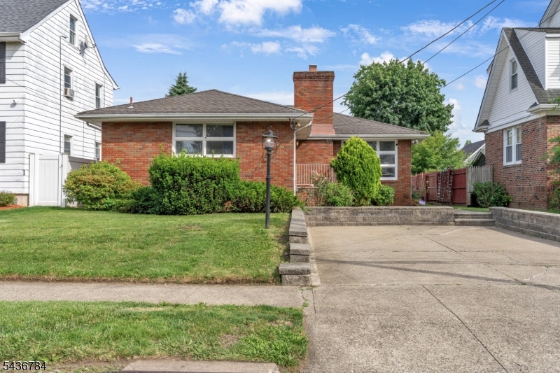 Welcome to this beautifully updated ranch-style home featuring 3 large bedrooms and 2.5 bathrooms, located in the highly desirable Hillcrest section of Paterson. Filled with abundant natural light, this inviting home offers an open-concept layout with hardwood floors, an updated kitchen featuring modern finishes and stainless-steel appliances, spacious living and dining areas, a private primary suite, and ample closet space throughout. The large semi-finished basement provides excellent space for recreation, storage, or future expansion. A solar energy system helps improve energy efficiency and reduce utility costs, while the EV charging setup adds convenience for electric vehicle owners. Step outside to a fully fenced backyard, perfect for entertaining, gardening, or relaxing. Conveniently located near shopping, parks, schools, houses of worship, and major highways, this move-in-ready home offers the perfect combination of comfort, space, and convenience. Home sale is contingent upon seller finding a home. Seller is looking aggressively.
