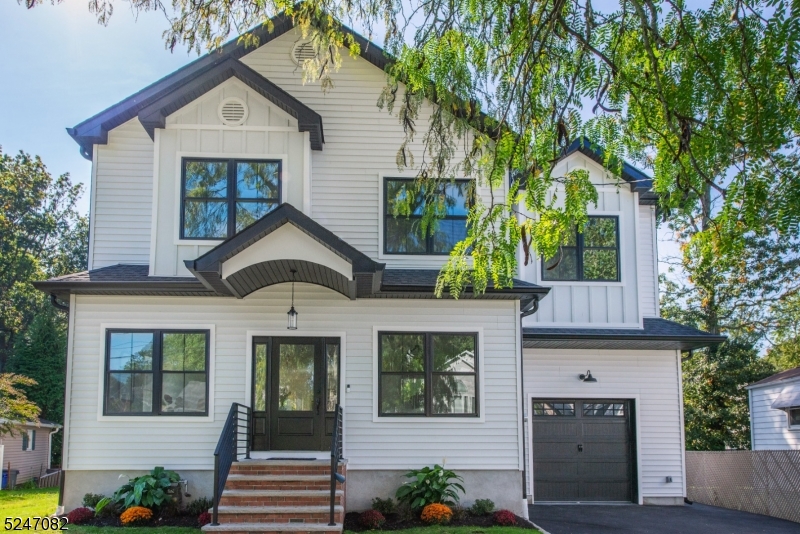 Be the FIRST to live in this NEWLY BUILT Luxurious 5-bedroom colonial on one of Kenilworth's most desirable streets! Top-quality materials meticulously designed & installed w. exceptional craftsmanship, curated by TOP NJ Builders. As you step inside, you're greeted by the radiant beauty of solid oak hardwood floors, an open floor plan, & opulent finishes throughout. Abundant natural light fills the space, & 9-foot ceilings on both the 1st & 2nd floors adds to the grand, open, inviting, atmosphere. The dining room will impress all of your holiday guests with custom millwork. The heart of this home, the chef's kitchen, leaves nothing to be desired.  Adorned w. soft-close cabinets, quartz countertops, top-tier GE stainless steel appliances, & an expansive center island complete w. a breakfast bar. Oversized pantry is perfect for bulk needs. Convenient mudroom off the 1 car attached garage is perfect for organizing. The first floor has a full bath & a potential first-floor bedroom or office. On the 2nd floor, master suite unveils itself as a serene oasis w. beautiful accent trim & tray ceiling. The marble-clad spa bath invites relaxation w. soaking tub & a rainfall shower. You will love the walk-in master closet/dressing room. Large guest bedrooms & functional guest bath appease all. Convenient 2nd floor laundry room. Fully finished basement features a full bath, expanding the possibilities for entertainment & relaxation. Great size yard, incredible location, & fantastic price!