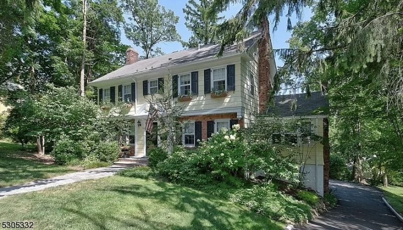 Discover your perfect suburban retreat in this elegant brick Center Hall Colonial, nestled in the desirable Upper Wyoming section. This home boasts spacious rooms adorned with beautiful architectural details, including a stunning chef's kitchen that features all the modern amenities and opens onto a charming deck. The second floor is dedicated to relaxation, with a master suite and three additional bedrooms. The third floor offers a serene haven with two more bedrooms and a full bath. Plus, the walk-out basement and attached two-car garage add convenience and extra space. This home is ready to welcome you.