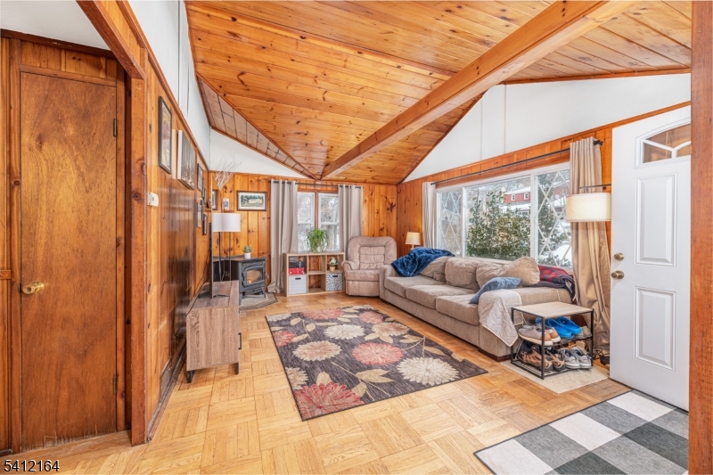 Back on the Market!!! This wonderfully charming Ranch sits right around the corner from the Lake Tamarack!  The living room has a unique high ceiling with a pellet stove which is makes it warm and cozy. The basement is a walkout with high ceilings creating so much potential for finishing! Located 2 minutes to the park and ride to the port authority in NYC. Enjoy fishing, conoeing, kyaking, and swimming, or simply watching sunsets!