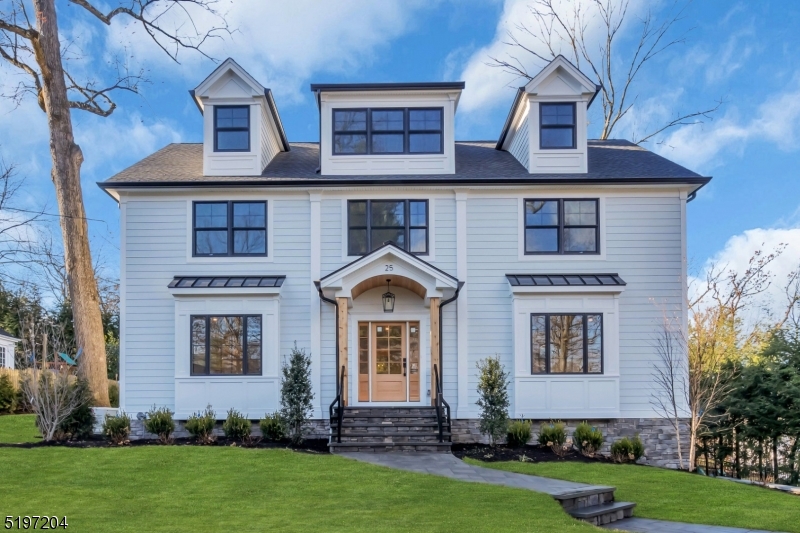 Stunning new home located in Chatham's prestigious Upper Washington area. This custom farmhouse colonial boasts 6 bedrooms and 5 1/2 baths with 4 levels of fabulous living space and impeccable attention to detail.  The moment you walk inside you will notice the beautiful white oak floors set in a herringbone pattern, stunning black Anderson windows and impressive 9-foot ceilings with oak beams. The kitchen is dressed in white custom cabinets, Wolf and Subzero appliances and elegant quartz countertops.  Noteworthy family room features include a floor to ceiling brick fireplace, expansive sliding doors (approx. 12 feet wide) and abundant natural lighting. The stately brick wine wall located in the butler's pantry is sure to impress your guests.  Opposite the wine wall is a high-end Wolf coffee bar perfect for everyday use and entertainment. Upon entering the primary bedroom suite on the 2nd floor, you will be impressed with the Serena & Lilly chandelier, high ceilings with oak beams, large closets, and radiant flooring in the bathroom. There are also 4 more bedrooms and a laundry room on this level. The expansive 3rd floor can be used for almost anything such as a bedroom, playroom, or great room. The lower level consists of a mud room, recreation room, utility closet, a gym/storage space, and the entrance to the spacious 2-car garage. There are so many great features to this home; you must see it for yourself to fully appreciate all it has to offer!
