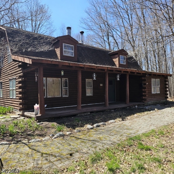 Exceptional property in a truly special setting! This home offers incredible potential and is ready for your finishing touches. Nestled beside over 100 acres of protected land owned by the Nature Conservancy, you'll enjoy direct access to scenic trails and a peaceful, private environment.The property features a larg, level garden area, a huge shed that was once used as a hourse stall with an open field and an above ground pool, all needing some TLC perfect for those seking a rural lifestyle. Upstairs the house needs some renovating as the original primary bedroom had been converted into two bedrooms and now requires refinishing. The spacious bathroom is functional but also ready for completion, and there's a privacy deck off this area that overlooks the rear property.On the main level, wide-plank hardwood floors are in good condition throughout. The kitchen and family room feature large tile flooring, with sliding doors leading to a walkway and detached garage. The living room could be seperated into a den and living area which includes a wood-burning fireplace with a raised hearth, and the family room has a pellet stove (currently working), though it needs sheetrock for cosmetic purposes.The powder room includes washer and dryer hookups with room to add a closet. With solid bones, an unbeatable location, and a serene natural setting, this property is a fantastic opportunity to create your dream home.