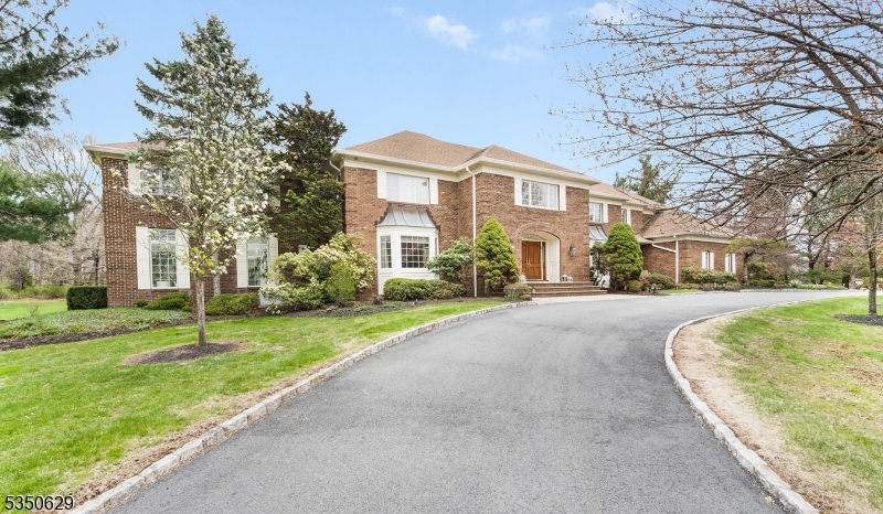 Experience luxury, comfort and convenience of this William Halsey designed home on the East side of Menham. A two-story marble foyer opens to a circular stairway and the grand living room, complete with floor to ceiling windows. A new stunning chef's kitchen includes a Subzero refrigerator, Wolf stovetop and double ovens, a large island and much more. The side entry leads to a second stair and au pair suite. A dream retreat awaits in the sunroom, fun in the billiards room and comfortable evenings  fireside in the family room. The spacious master suite boasts of a bright sitting room, 5 W/I closets and a luxurious bath with a bidet and steam shower. The Princess suite has 3 W/I closets. 2 additional bedrooms and an office complete the 2nd floor. The versatile basement has a temperature-controlled wine room with a mini kitchen, full kitchen, full bath, exercise room, office, huge rec room and plenty of storage. This home is perfect for entertaining inside in the elegant dining room or out on the private stone patio. Worry free, this home boasts of a generator, new baths, updated mechanical systems, and an oversized garage with an epoxy floor. There are virgin hardwood floors under all of the carpets. Mendham has top rated schools with an international baccalaureate Program. Conveniently located close to NJ Transit, Morristown Hospital, theater, golf, parks/recreation, restaurants, and shopping.