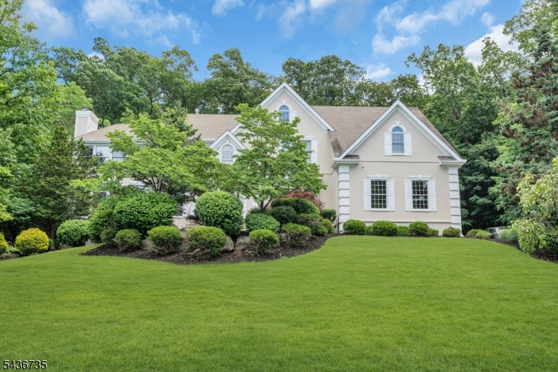 Welcome to 66 Beachmont Terrace! This stately 5 bed, 5.5 bath center hall colonial is situated in one of North Caldwell's most sought-after neighborhoods and truly offers the BEST of luxury living. As you enter the foyer, you are greeted by soaring cathedral ceilings that set the tone for the grandeur that awaits. To your left, discover the oversized yet cozy living room appointed with the first of three fireplaces. To your right, you will find the elegant dining room with subtle woodwork detail, perfect for hosting more formal dinners and holidays. The dining room and kitchen are thoughtfully connected by a butler's pantry.  As you continue towards the back of the house, the bright eat in kitchen flows directly to the spacious family room. Step outside to the oversized deck to enjoy effortless alfresco dining. The deck leads down to a lush and private yard surrounded by woods--perfect for playing and entertaining.  The first floor also boasts a 5th bedroom/office with its own bath. Upstairs you will find four additional generously sized bedrooms with ensuite baths. The primary suite and 4th bedroom both offer their own private sitting rooms which provide additional space to work or unwind. The full finished basement is equipped with a home gym and playroom, as well as a full bath with sauna. 66 Beachmont seamlessly blends timeless charm with modern amenities offering a lifestyle of both sophistication and comfort.