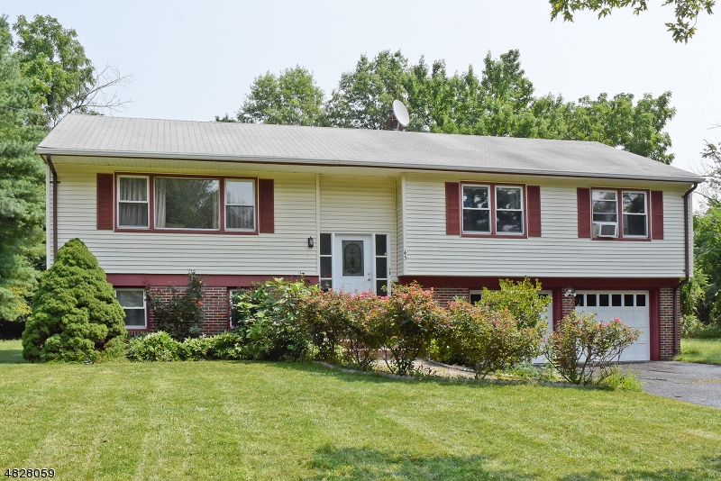 Wonderful oversized bi-level in a Desirable Neighborhood of Parsippany. Corner and big lot. Home with Many Possibilities. Priced below market price to sell quick. Approx 2348 sq ft house. Low tax. Spacious Hardwood floors throughout main level. Main level offers formal big size Living room, Dining, Eat-in Kitchen, Master Bedroom with 1/2 bath, 2 Additional Bedrooms, Full Bath & private big size Deck completes the Main Floor. 1st level Offers huge Family room, Full Bath, Laundry room, Utility room and 2 over sized Garage. 4th bed is possible on 1st Level where closet is ready. Abundance of Natural Sunlight. Park like backyard for all of your outdoor entertaining. Close proximity to shopping, all major Highways & public transportation and NYC park and ride!! Home Warranty is a plus. Offer  accepted.