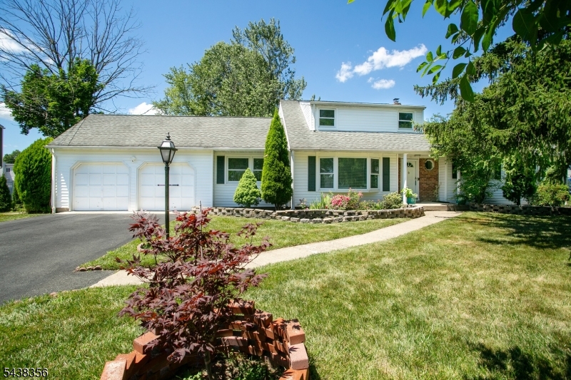 Spacious, beautiful east-facing 6-bedroom home very near distance from elementary, middle, and high schools, featuring a gorgeous updated kitchen with brand new granite countertops for cooking and entertaining. The first floor has amazing hardwood flooring throughout the Living Room, Family Room, Dining Room, Bedroom, and Master Bedroom. The first-floor Master Suite includes a walk-in closet and a private master bathroom with a shower. With three bedrooms on the first floor and 3 additional bedrooms on the second level, this property  has amazing flexibility for guest rooms, home offices, and storage. With a 2-car garage and a double-wide driveway, plenty of parking is available for many vehicles. Conveniently located near Routes 46, 80, and 287, and public transportation options, commuting is a breeze and efficient. 4 internet-controlled Ring Cameras and internet-controlled smart lights can help you build the smart home of your dreams. With an installed, fully owned water softener, reverse osmosis filter, sump pump with power-failure backup system, and fiber optic internet, all amenities are in amazing shape.