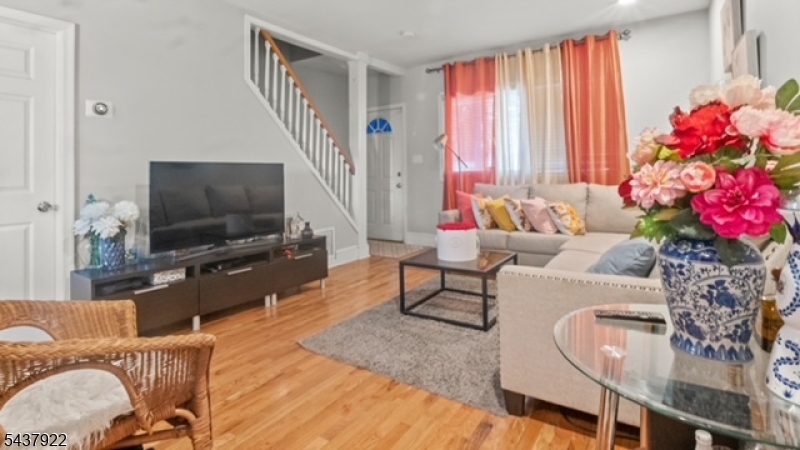 Renovated single family home in a desirable neighborhood.Close to Garret Mountain  Move in ready house featuring 2 bedrooms Balcony of main bedroom, 1.5 bathroooms, with a bonus room in the basement.  Driveway. Central A/C thoughout home. newer roof and siding.  LOW TAXES!!!!!!