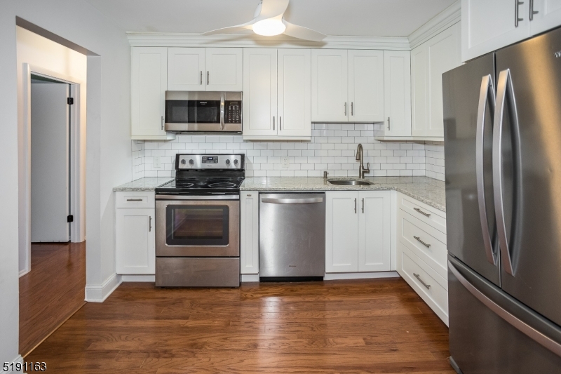 Do not miss the opportunity to live so very close to Morristown Center yet have secluded privacy facing one of the oldest national parks in the US.  Walk out on the patio and enjoy the wooded hill behind this condo complex.  Recently renovated kitchen baths and floors.  Brand new in unit washer dryer just installed.  One floor living at its best with no stairs upon entry of the secured lobby.  Take the elevator to the 2nd floor and enjoy this 2 bedroom 2 full bath (one in Primary bedroom) condo.  Great open concept flow between the living room, dining room and Kitchen makes it great for entertaining.  Enjoy the shopping, dining, performing arts center, and mid town direct train to Penn Station and then retreat to your own private oasis.  Building has a gym for residents use on lobby level.  Parking is 1 assigned space and 1 unassigned space first come first served.  A maximum of two cars per unit is part of the by laws.