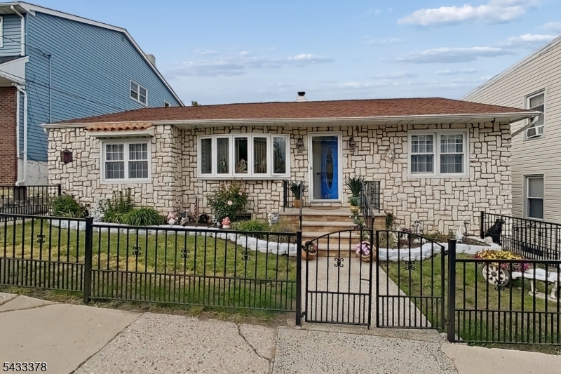 Welcome to 249 Bergen Ave in our beloved Town of Kearny! This well-maintained ranch-style home offers comfort, functionality, and a convenient location all in one. A ranch home for sale in Kearny? There are not a lot of those! Step inside and experience a bright living room, a formal dining area, and a very functional kitchen, perfectly designed for everyday living and entertaining. The home features generously sized bedrooms and a full bath, providing a practical and inviting layout. The exterior space is truly amazing! Enjoy plenty of parking and a very large backyard ready for incredible outdoor living, entertaining, relaxing, gardening, or simply enjoying your own private retreat. The garage was converted into additional living space, offering flexibility for extended use, a recreation area, or a home office, but can also be converted back into a garage if desired. Take advantage of the great lower level, already offering excellent potential for additional living space and featuring direct walk-out access to the backyard. Located near schools, parks, shopping, public transportation, major highways, and convenient NYC commuting routes, this home offers both lifestyle and accessibility. Please peruse all the pictures and explore the detailed floor plans we prepared for you. Schedule your private showing today, and come experience everything this wonderful home has to offer. We will meet you at the front door!