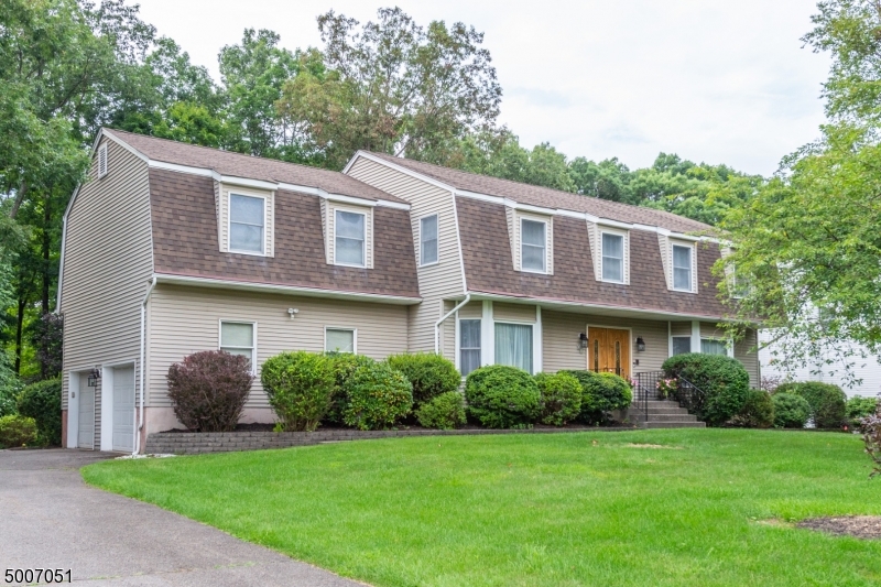 Spacious Colonial in desirable neighborhood. 2 story, skylight lit, foyer, with security system, ring door bell, whole house generator, 2015 high efficiency boiler, water softner & sprinkler system. Enjoy an updated kitchen with granite countertops & stainless appliances. Living rm has pocket doors to Family rm with wood burning fireplace. Master bedroom has two walk-in closets & a make-up/changing area. Down the hall is a 22x17 multi-purpose bonus rm over the garage. Walk thru glass sliders from your eat in kitchen to relax in the heated/air conditioned, spacious sunroom with vaulted ceiling while overlooking your beautifully landscaped, private yard through three walls of glass with blinds to control the sunlight. The basement has tons of closets, storage space and a workshop that is second to none!