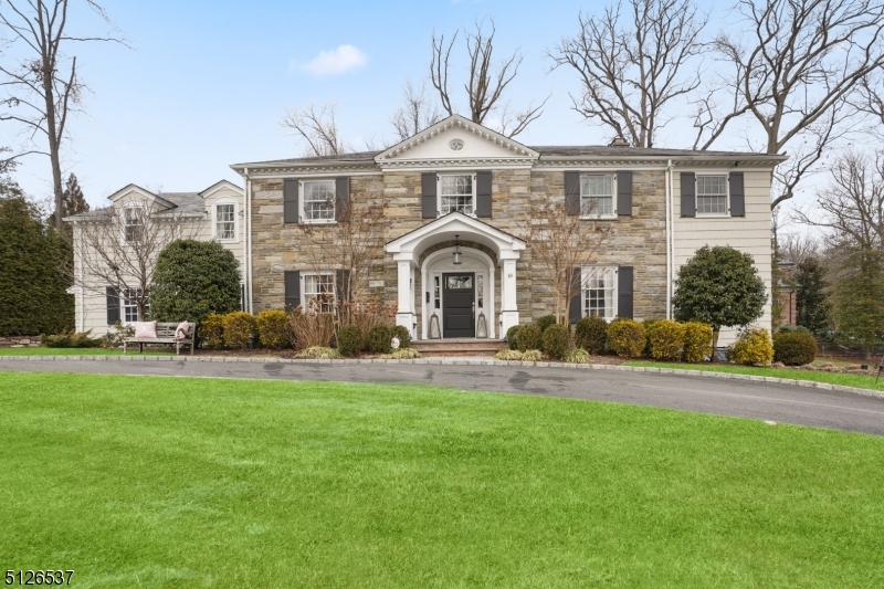 Extraordinary designer home with bespoke finishes and uncompromising style.   The two-story entry foyer invites you to enjoy the custom layout with incredible attention to detail found throughout this one of a kind Colonial.  Set on a gorgeous knoll with a circular driveway, this perfectly located home is just a short distance from the NYC Midtown Direct Train.