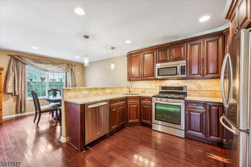 This updated end-unit townhouse offers 3 spacious bedrooms, 2.5 baths, and a prime location in a desirable community. Renovated in 2013, the home boasts an inviting foyer with hardwood floors, leading to an open-concept living and dining area, modern kitchen, powder room, and laundry room. The brand-new 2024 composite deck off the living room provides a perfect space for outdoor entertaining, while the private backyard adds a serene retreat.Upstairs, the primary suite and two additional bedrooms offer comfort and convenience, along with two full baths. The unfinished basement presents endless possibilities for customization, whether as a home office, gym, or extra living space. The community amenities include a pool, clubhouse, and access to scenic hiking trails at nearby Torn Country Park.Excellent school district, including Rockaway Valley School and award-winning Mountain Lakes High School. With its close proximity to shopping, dining, major highways, and recreational areas, this home is an exceptional opportunity for buyers seeking comfort, convenience, and value. Sold "as is."