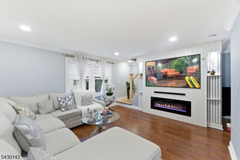 One of a kind elegant and beautifully renovated end-unit townhome in Passaic, offering a refined blend of style, comfort, and convenience. This thoughtfully updated residence features laundry, utility and garage on the ground level. Main level features nice living room, dining room, gorgeous recently updated kitchen with a sliding door to a deck where you can grill and entertain or even watch TV! Second floor offers 2 spacious bedrooms and 1 beautiful bathroom. This great home features a central air and force hot air. With its desirable end-unit setting, the home enjoys enhanced privacy, abundant natural light, and a sophisticated atmosphere throughout. Must see to appreciate - this home is move-in ready!