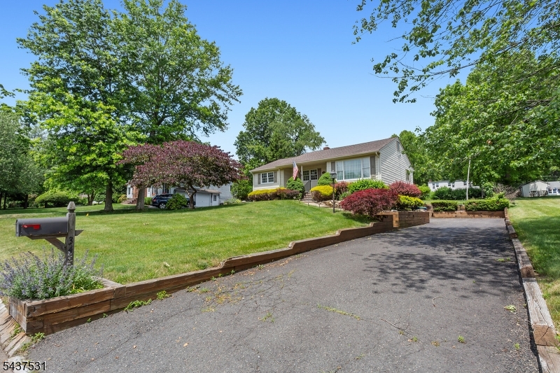 Welcome home to easy living in this charming 3 bedroom, 3 bath ranch, nestled in desirable Basking Ridge.  This home features an updated kitchen with an adjacent dining area, a large family room complete with a gas fireplace, and an equally large formal living room. There are hardwood floors throughout the house and the family room features a skylight.The basement is partially finished with a full bath. The home shows the loving care of the original owners of 60 years. The yard features mature plantings with an oasis of a landscaped pond with flowing water and a composite deck for outdoor enjoyment. Centrally located within walking distance to the excellent Basking Ridge schools, shopping, train station and the historic center of town.