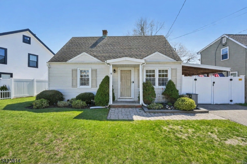 Welcome home to this charming 3-bedroom, 1-bathroom Cape Cod nestled on a quiet residential street. Step into the entry foyer that opens to a sunlit living room filled with natural light from large windows, creating a warm and inviting atmosphere perfect for everyday living and entertaining. The living room flows seamlessly into an elegant dining room, offering an ideal setting for intimate dinners or hosting guests. A large cased opening leads into the eat in kitchen, featuring custom cabinetry, ample counter space, stainless steel appliances,laundry and direct access to the backyard. Just off the kitchen, you'll find a convenient first-floor bedroom and full bathroom, offering flexibility for guests or one-level living. Upstairs, two generously sized bedrooms provide comfortable retreats, each with ample closet space. Step outside to a backyard designed for enjoyment and relaxation. The covered patio creates the perfect setting for outdoor dining, grilling, or unwinding in the shade, while the fire pit area invites cozy evenings under the stars. The fully fenced yard offers both privacy and space for entertaining, complete with an above-ground pool for summer fun and plenty of room for recreation. Two storage sheds add convenience, and the expansive driveway provides ample parking. Ideally located near NYC transportation, shopping, and dining, this home offers comfort, versatility, and an exceptional outdoor lifestyle perfect for making lasting memories both inside and out.