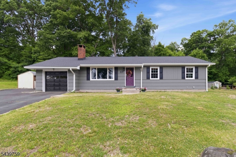 Welcome to 69 High Avenue in Randolph - this is a spacious 3 Bedroom 2.1 coveted Ranch home that backs up to Hedden County Park. Privacy galore! This Bright and Spacious home has hardwood flooring throughout most of the home. The kitchen has beautiful wood cabinetry, stainless steel appliances, large pantry and skylights. Enjoy the wood burning fireplace in the spacious living room. There is an oversized laundry room that leads to the garage and backyard. The finished basement ( 44 x 13 ) is large with a full bath.  Step outside in your private yard and enjoy your new wood deck.    Conveniently located to major roads, shopping and restaurant. Don't wait!
