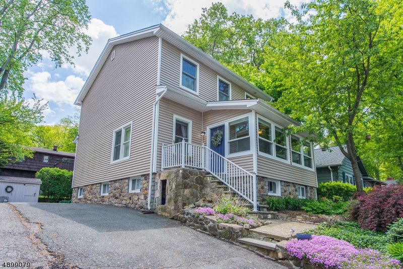 Pristine, Updated Colonial! Charming through & through! Bright, Large Sunroom- enjoy the natural light & Indian Lake views. Lovely Architectural Features, Give this Home a Cottage Feeling! Living area boasts cozy dining area w/built ins & vintage faux fireplace. Functional, updated kitchen w/bfast bar & bonus FR. Beautiful HW flooring throughout. 2nd floor offers 3 BDRMS & full bath PLUS a grand master suite w/cathedral ceilings, generous walk-in closet & bath w/spa shower. Pull down steps to attic, generous 2nd floor hallway. Full bsmt will be sheet rocked & painted, a real bonus! Bsmt offers a Rec room, office & full bath. Mudroom to backyard patio & fire pit. Tremendous curb appeal! Located just steps from Indian Lake clubhouse. Easy access to NYC Direct train/bus & hwys. Whole house generator.