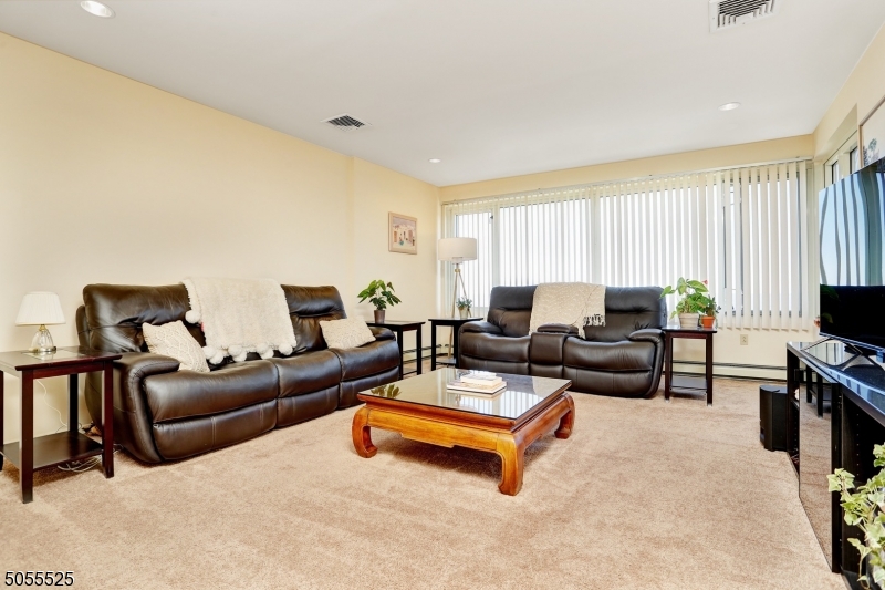 EXPECT TO BE IMPRESSED! BEST View ever..2 balconies overlooking the NY skyline. Open and airy. East facing to NY What a view. 24 hour parking. Large living room and dining room. Watch the fireworks! Great kitchen and Bedrooms with balconies. Large  Master Bath. Plus second bath. Walk in closet. Laundry in unit. Great layout. Tenant is breaking lease due to a business relocation, they had waited a long time for this specific unit.  You will not be disappointed.