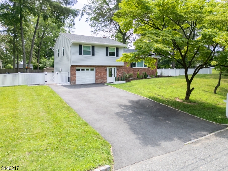 Beautifully updated and truly move-in ready, 32 Headley Ave offers the perfect blend of modern comfort, thoughtful upgrades, and a warm, inviting feel in desirable Morris Plains. This 3-bedroom, 2-bath single-family home was extensively remodeled in 2024, with nearly every major feature updated for today's buyer. Inside, you'll find a bright and welcoming layout with wonderful natural light, newer wood floors throughout, new windows, updated lighting fixtures, recessed high hats, and a brand-new wood-burning fireplace with a completely rebuilt chimney.The renovated kitchen features new appliances and a clean, modern design, while both bathrooms have been tastefully redone. Additional updates include new heating and air conditioning, updated plumbing and electric, new roof and siding, and a brand-new high-end washer and dryer. Outside, the large, fully fenced backyard is a true highlight, offering plenty of space to relax, entertain, garden, play, or unwind by the firepit. A new fence was added in 2024, followed by an extended paver patio and paver firepit area in 2025, creating a beautiful outdoor setting ready to enjoy.With extensive updates inside and out, a spacious backyard, and a convenient Morris Plains location, this is the kind of home that feels easy to love from the moment you arrive.
