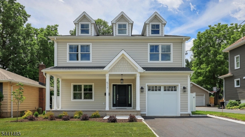 Exceptional *brand-new* construction by Tower Homes, offering over 5,800 sq. ft. of finished living space across four levels on a .23-acre lot. This 5-bed, 4.2 bath home showcases premium craftsmanship, custom finishes & a level of completeness rarely found in today's market. At the heart of the home is an exceptional chef's kitchen featuring premium custom-designed cabinetry with furniture-quality craftsmanship, an oversized stone island, GE Cafe appliance suite, beverage center and spacious dining area. The adjoining family room is highlighted by a coffered ceiling & custom stone fireplace. The luxurious primary suite offers a sitting area, walk-in closet, & spa-inspired bath with double vanity, dedicated makeup station, freestanding soaking tub, oversized frameless glass shower & enclosed water closet. The 2nd level also features spacious bedrooms and laundry. Additional highlights include extensive millwork, crown molding, red oak hardwood flooring, custom mudroom with built-in cubbies, a finished 3rd-floor suite with full bath & a massive finished basement with rare soaring ceilings. Constructed with James Hardie siding, Azek trim, Andersen windows, GAF roofing, & 2-zone Lennox HVAC. The landscaped grounds feature a fully sodded lawn, underground irrigation, composite deck, gas grill connection, porcelain paver front porch & private fenced backyard. Conveniently located near Cranford's vibrant downtown, top-rated schools, parks, restaurants, shops, & NYC transportation.