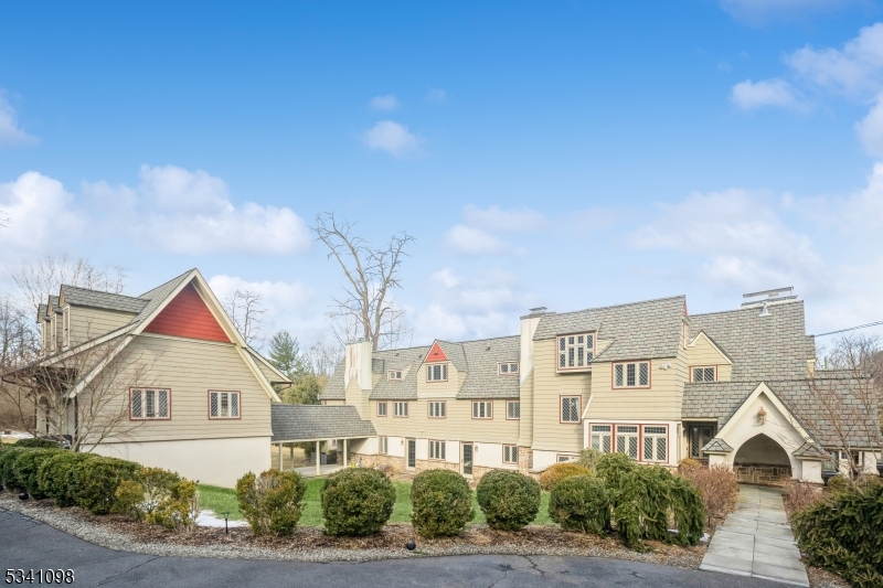 Here's an opportunity to own a piece of Mendham Boro history. Known as the "Chapel Hill Manor" steeped in historic grandeur with modern elegance. This 6600 sqft work of Art features 6 bedrooms, 4 full and 2 half baths; an updated Grand movie theater, original paneled library w/secret passage, and En Suite / Au pair w/fire place and full kitchen. A beautiful kitchen with center island and open floor plan, great for entertaining guests. A piano room. Dark hardwood floors throughout add warmth and sophistication. The primary suite has a beautifully finished marble and slate bathroom w/ rainfall shower and jetted tub with 2 walk-in-closets. Second floor laundry. A one of a kind property in the heart of Mendham Boro w/top rated school system offers modern conveniences while maintaining the craftsmanship of class from a time gone by.