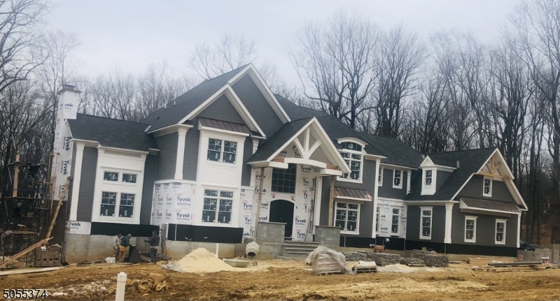 CRC Communities does it again!  What a beautiful home under construction and will be ready by the end of summer. This home sits on almost 2.5 acres and backs to parkland. As you enter this home thru a custom front door, this home offers 10' ceiling heights on the first floor, 8' interior doors, real hardwood floors which you can pick your stain color, gourmet kitchen with Viking appliances, granite countertops which you can still pick, breakfast room with access to the cover porch.  3 fireplaces - family room, library and master bedroom.  The custom trim in this home is outstanding.  Central vac, alarm,  4 car garage.