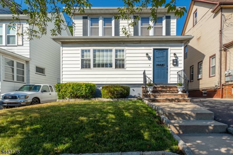 Welcome to this beautiful one-family home located on a quiet block in the highly desirable Elmora section of Elizabeth! This completely repainted home features stylish wood laminate flooring throughout and includes central air conditioning. The driveway offers enough room for 3 cars.The main level welcomes you with a cozy sitting room that opens up to a spacious living room and a formal dining room. This level flows effortlessly into the updated kitchen featuring granite countertops, stainless steel appliances, and a breakfast counter that comfortably seats 2 to 4. A modern, updated half bath completes this floor. Upstairs, you'll find three comfortable bedrooms and a beautifully renovated main bathroom, plus a finished walk-up attic. Downstairs, the partially finished basement offers the perfect bonus space to entertain guests or use for extra storage, equipped with electric baseboard heaters.Your Private Outdoor Oasis awaits! Step outside into a beautiful, fully enclosed backyard featuring a vinyl privacy fence. This incredible space is built for summer fun and entertaining, Boasting an above-ground pool, elegant patio pavers, and a spectacular outdoor kitchen with a large granite counter.Conveniently located with easy access to local shopping and the beautiful Warinanco Park, this move-in-ready home offers the perfect blend of comfort, style, and location.