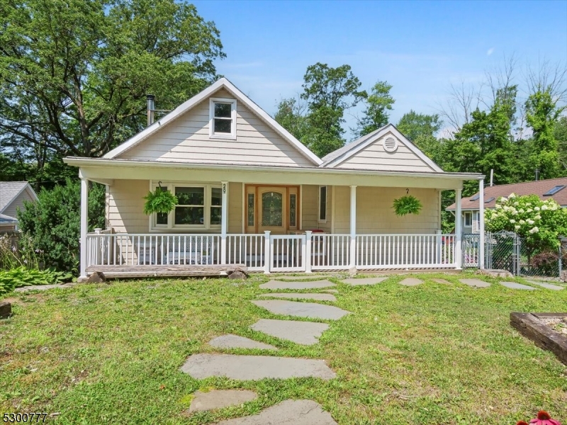 Calling all lake enthusiasts, first-time homebuyers, and downsizers! This unique arts & crafts/cottage style property set on over half an acre of flat land has too many features to list here! Located within the desirable PRIVATE Upper Greenwood Lake community that allows power boats. This generous sized 1 bdrm house features high, wood beam ceilings, a wood-burning stove that heats the entire house (say goodbye to your heating bill), an oversized detached 2 car garage, a large deck as well as a fantastic lemonade front porch for bird watching or morning coffee time. The ample front and backyard spaces along with a convenient circular driveway are perfect for entertaining loved ones in the summertime. You can literally carry your kayak to the nearest boat launch. Close to skiing, hiking, and all that Warwick, NY has to offer including: wineries, breweries, farms, shops, and restaurants. Priced to sell, this one won't last long! Come see it before it's too late! **Please close doors behind you at all times due to cat in home.** Thank you!