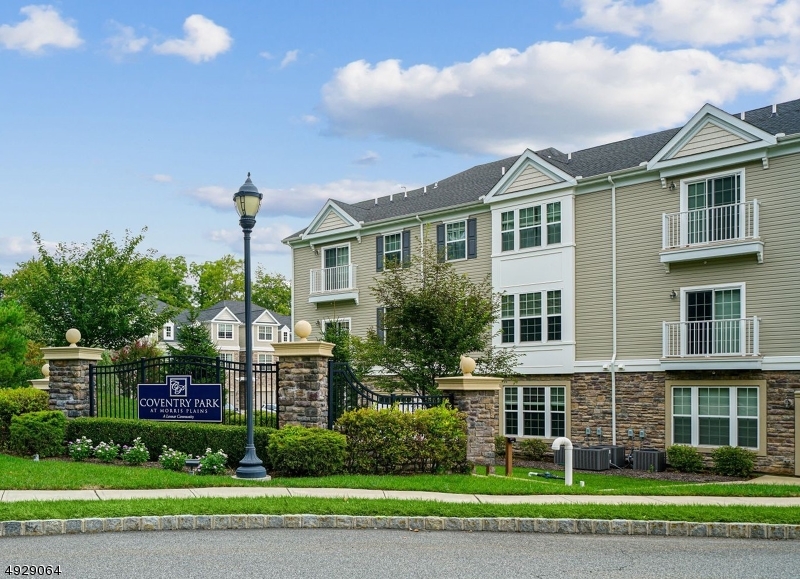 Pristine 2BR/3 full bath townhouse in desirable Coventry Park in Morris Plains.  High ceilings, HW floors, open floor plan with large windows that provide natural light.  Designer kitchen w 42" wood cabinets, SS appliances, breakfast bar and abundant counter space.  Dining area has slider leading to private patio.  MB has 2 closets and large en-suite bath.  The second BR has a large walk-in closet.  Shows like new, freshly painted, immaculately clean and ready for move in.  Great location close to NYC train, shopping, major highways and downtown Morristown