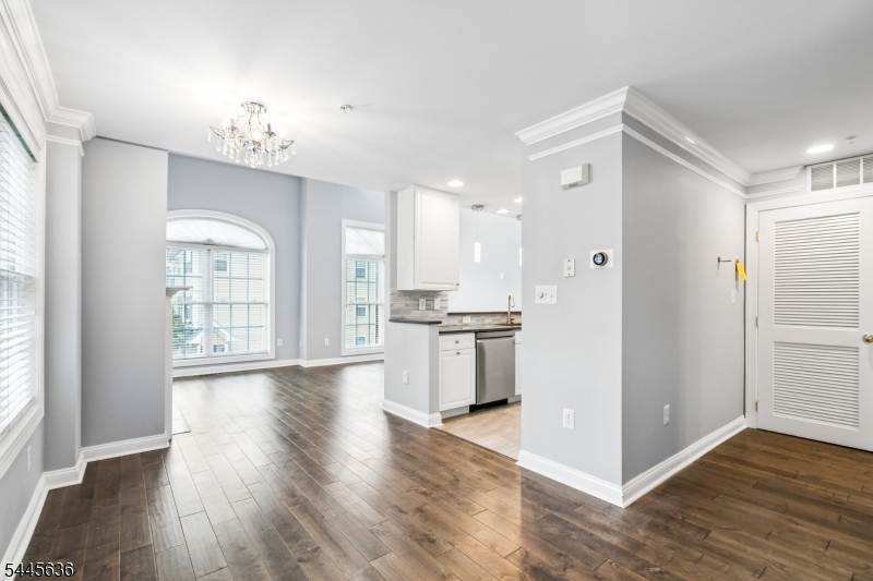 This stunning end unit, featuring an open-concept kitchen and three fully renovated bathrooms, is simply gorgeous. The kitchen boasts a pantry, ample cabinet space, bar height seating, and newer counters/ backsplash/ appliances. This level is completed by a dining room, powder room, and living room with gas fireplace and cathedral ceiling. Going up one flight you have the loft style family room that is large enough for both a TV viewing area and a home office. The laundry is conveniently found in the hallway to the 2 bedrooms, both of which overlook the Watchung Reservation (direct access from the neighborhood to hiking trails). The primary suite is nicer than many $1M+ homes, featuring a huge custom walk-in closet and a spectacularly renovated bathroom. The hall bath has also undergone a complete renovation. The convenience of the location cannot be overstated, with a brand new Shoprite at the newly revamped Blue Star shopping center (1 mile), LifeTime Fitness (2 miles), Trader Joe's and downtown Westfield (4 miles), and countless stores and restaurants in close proximity. Commuting is a breeze with easy access to Rt-22 and I-78 plus the express NYC buses (114 and 117) to Port Authority. Your investment is sound as you consider the highly rated Scotch Plains-Fanwood school system. Make this beautiful townhome yours this summer.