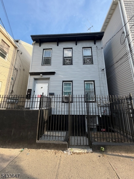 Excellent opportunity to own this two-family home featuring a classic Colonial-style layout. The first and second floors each offer 3 bedrooms, 1 full bathroom, living room, and kitchen, providing comfortable living space for occupants or tenants. The third floor includes an additional 2 bedroom unit with 1 full bathroom, offering extra living potential. Finished full walk-out basement adds bonus space and versatility. Property features gas heat, radiator heating system, aluminum/vinyl exterior, and window A/C units. Conveniently located near transportation, shopping, schools, and major highways. Great opportunity for owner-occupants or investors seeking strong rental potential.