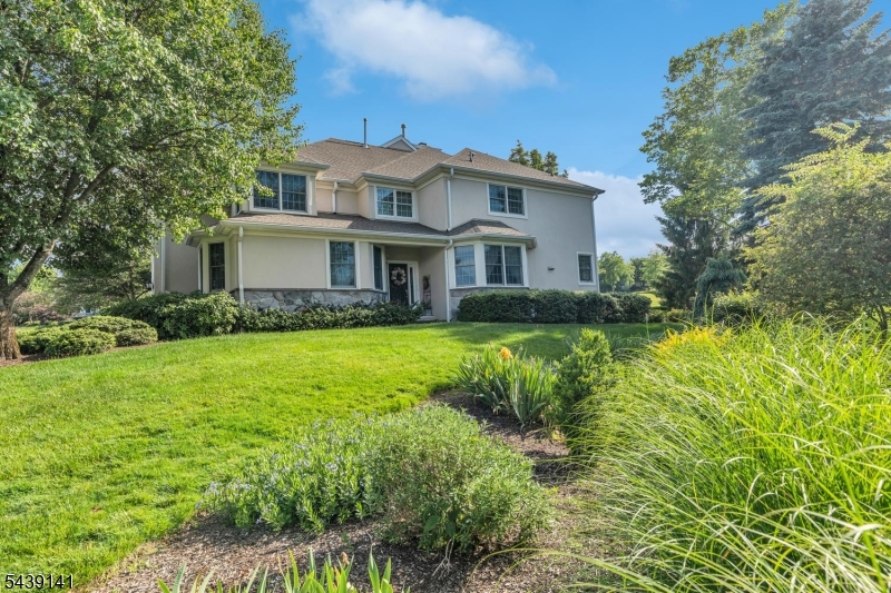 Discover the epitome of luxury living in this fantastic 3-bedroom townhome in the prestigious Amherst Mews development, offering breathtaking views overlooking the NJ National Golf Club. Meticulously maintained, this home boasts an open floor plan designed for effortless entertaining. The main level features an elegant living room and dining room, as well as an expansive family room with gas fireplace flanked by custom built-ins, including a wet bar. This opens directly to the kitchen, complete with center island, abundant cabinetry and prep space, and breakfast area. 2nd floor great room has custom built-ins including bookshelves, file cabinets and electronic accommodations. The primary suite offers 2 large walk-in closets and bathroom with double vanity, soaking tub, separate stall shower, and makeup vanity. 2 additional spacious bedrooms and full bath complete this level. The basement is a showstopper, boasting a custom wine cellar, built-in bar, and ample space ready for personal customization. Step outside to a stone patio & 20 ft dry-stone wall with stunning golf course views. Some updates include new EIFS siding, new lower level HVAC unit, new hot water heater, and new roof. Residents enjoy exclusive community amenities including a clubhouse, pool, tennis courts, and gym. Situated in a top-rated school district and conveniently close to transportation, restaurants, and shopping, this exceptional townhome offers the ideal blend of sophistication, comfort, and location.