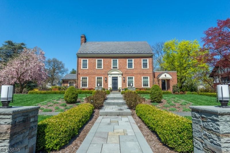 This iconic Francis Nelson colonial has been renovated with sensitivity & style. From the exterior landscaping to the interior systems, experts have been consulted & careful strategic decisions have been made to ensure that this home reflects the artistry of the original Nelson style as well as the ease & comfort of today's living. All of the major systems are state of the art. The large level lot has been landscaped & lighted to display its beauty. Nelson took care to make the entry to his homes an invitation with carved moldings & special doors. The current Owners built on that tradition. The LR, FR , 2 offices, bath & PR on the first floor are fitted with custom built-ins. Whether an INTIMATE GATHERING or large party, guests feel the warmth & comfort. The carefully appointed chef's kitchen with an abundance of storage stands at the ready as does the formal dining room with custom cabinetry. A private guest suite completes the first floor. The primary suite on the second floor reflects the sense of the original design. A southern exposure lights the bedroom while the luxurious bath overlooks the backyard. Two other bedrooms with ensuite bath & custom built-ins make for easeful organization. family room/br & bath on the 3rd fl are a private hideaway. Basement gym, PR & storage complete this thoughtful renovation. Sonos sound system throughout Enjoy a summer's eve on the patio complete with fireplace & fire pit. Well water feeds the sprinkler system