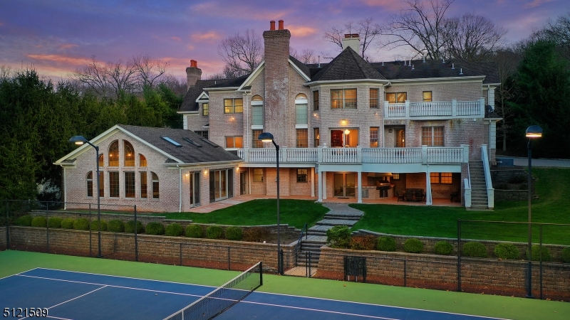 Majestic Lake Front custom home, Lighted TENNIS CT and INDOOR heated swimming Pool with its own shower/change room, Grand scale rooms with intricate custom mill works, well positioned rooms are formal & elegant showplaces, yet an exceedingly warm & comfortable home to meet today's lifestyle, Mahogany double door leads to impressive sweeping crown stairs, introducing all rooms with artful details and inviting ambiance, Scrumptious kitchen is spacious and delightful leading to porcelain tile masonry balcony over-looking tennis court and lake, Retreat style master suite has fire place, lounge with lake view and His & Hers baths, all other deluxe bedrooms are En-Suite with private bath, high volume ceiling and large closets, Well finished walkout lower level has full kitchen with dining area, Great Room with fire place, full bath, BRs, gym, game room and second laundry room to service pool room, Covered Porch overlooking tennis court with built in BBQ set up, all Amenities are here in-house to enjoy year round at HOME