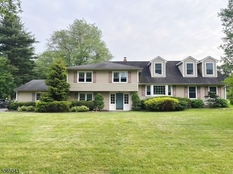 This beautifully designed split-level house boasts 4 beds and 2.5 baths across over 2,900 sq. ft. of living space. Step inside to discover hardwood floors throughout the first floor, leading to a bright, renovated kitchen featuring marble countertops, new gray tile backsplash, and brand new stainless steel appliances. The open layout connects the living room and formal dining area, creating a flow for entertaining. A versatile sunroom/office offers a peaceful retreat separate from the main living spaces. Step outside to the charming back porch and take in serene views of the private level 1.09-acre lot. Nestled in a desired neighborhood, this home offers unbeatable convenience to dining, boutique shopping, Highlands Village Shopping Center, and major highways (287/78/202). Ridge High School in Bernards Township is one of the top rated school districts in NJ, coming in at 29th in New Jersey as per US News and World Report, 2025.