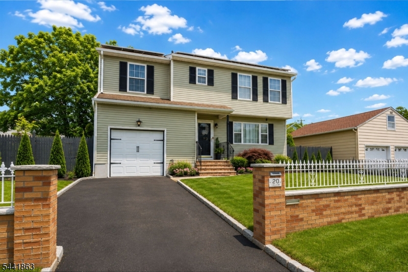 Gorgeous 1-Family featuring 4 large bedrooms, 2.5 bathrooms, and a fully finished basement, offering plenty of space for comfortable living, entertaining, and working from home. This beautifully maintained home showcases hardwood flooring, tile finishes, and thoughtful upgrades throughout. The main living area features a stunning custom designer accent wall with modern wood slat detailing, built-in floating shelves, and an electric fireplace, creating a stylish and inviting focal point. Large windows fill the home with natural light, enhancing the warm and welcoming atmosphere. The spacious finished basement provides endless possibilities and is ideal for a recreation room, media room, home office, fitness area, or additional gathering space. Enjoy substantial energy savings with owner-owned solar panels. Located across from protected land and just steps from a city park, this home offers the perfect balance of privacy and convenience. Commuters will appreciate the easy access to major highways, public transportation, shopping, dining, and everyday amenities. The four generously sized bedrooms provide flexibility for growing households, guests, or dedicated office space. The primary suite offers a private retreat, while the additional bedrooms are spacious and well-appointed. Meticulously cared for and truly move-in ready, this home combines modern upgrades, energy efficiency, generous living space, and an excellent location.