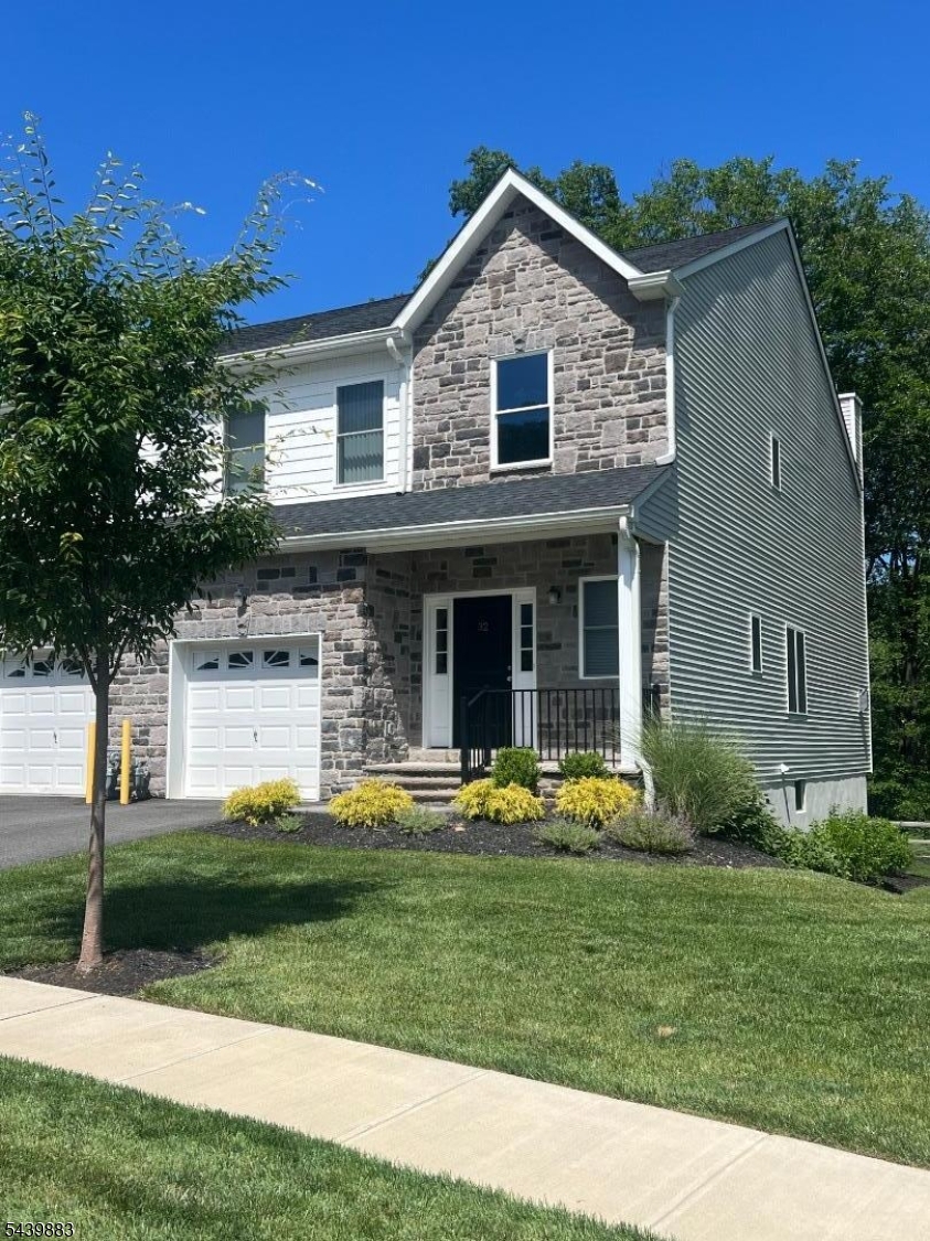 Newer townhouse complex, Mountain Way is in one of Parsippany's most sought out neighborhoods!  Sycamore Model is a rarity with a Dining Room and generous sized Family Room with open concept Kitchen!  Walk into the double story foyer, high ceilings, with an open concept. Bright and airy with neutral colors.  Hardwood floors downstairs, gas fireplace and deck. Carpeted stairs lead you to the upstairs wall to wall carpeting living area.  Two generous sized bedrooms at the back of the hallway with a full bathroom outside the rooms.  Generous sized Master Bedroom with full Master Bath inside room. This ideal location, while nestled in the mountain landscape of Morris County is also a commuter's dream - close to various NJ transit buses and trains, and all major highways, including Route 287, Route 46 and Route 10 - you are only 30 miles away from NYC!