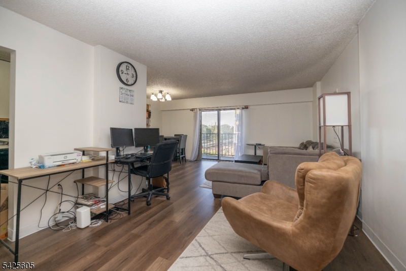 Commuter's Dream in the Heart of Linden! Why continue paying rent when you can own? Whether you're a first-time buyer or looking to simplify your lifestyle, this inviting 1-bedroom, 1-bath condo offers the perfect blend of comfort and convenience. Located just steps from the Linden Train Station, this sun-filled, single-level unit on the 7th floor features an open, airy feel and a private balcony with pleasant views perfect for relaxing or enjoying your morning coffee. Additional highlights include a laundry area conveniently located on the same floor and the rare bonus of two dedicated parking spaces. With restaurants, shops, and everyday essentials right outside your door, this home delivers effortless living in an unbeatable location. Comfort, convenience, and value all in one place.