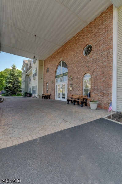 Welcome to Bald Eagle Commons, a sought-after 55+ community in beautiful West Milford. This well-maintained 1273 SF Greenbriar unit offers a spacious and functional layout with 2 bedrooms, 2 full baths, a bright living room, dining room, and eat-in kitchen with new laminate flooring. The spacious primary suite features a large walk-in closet and double sink vanity. Enjoy an active and social lifestyle just minutes from town with a clubhouse, pool, hot tub, tennis/pickleball courts, bocce, shuffleboard and multiple activity rooms in each building, including exercise, library, party, and card rooms & more! Join in on planned activities and trips or enjoy peace and quiet in your private space. Includes 2 storage cages, designated parking space and snow removal from your car in winter! Do not miss this one!