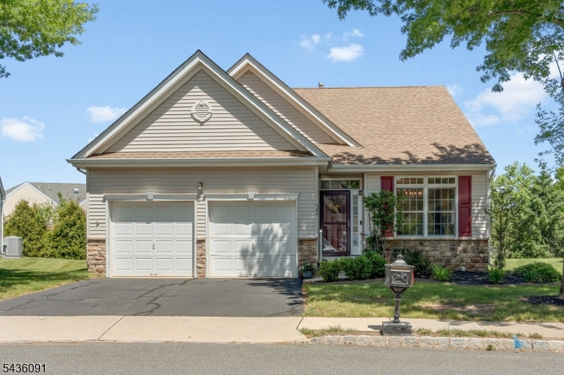 Welcome to 32 Benjamin Street, an exceptional Adams model in the highly sought-after Canal Walk 55+ community. This beautifully maintained ranch-style home offers 2 bedrooms, 2 full baths, and over 1,500 square feet of thoughtfully designed living space, all on one level.Step inside to discover exotic Acacia solid hardwood flooring throughout, soaring 9-foot ceilings, and a bright open floor plan ideal for everyday living and entertaining. The spacious Great Room features recessed lighting and flows seamlessly into the kitchen, complete with stainless steel appliances, granite countertops, and abundant cabinetry.The primary suite offers a peaceful retreat with a tray ceiling, custom closet organization, and a private en-suite bath. Additional highlights include custom closets, fresh paint throughout, a newer roof and air conditioning system (2024), and an unbeatable location just steps from Canal Walk's clubhouse and resort-style amenities. The HOA fee includes basic cable for added convenience.Experience the best of active adult living with two clubhouses, indoor and outdoor pools, outdoor spa, sauna, fitness center, tennis, pickleball, bocce ball and shuffleboard courts, putting green, card rooms, and a wide variety of clubs, activities, and classes. Conveniently located near shopping, dining, and major highways, this move-in ready home offers the perfect combination of comfort, convenience, and lifestyle in one of Somerset County's premier 55+ communities.