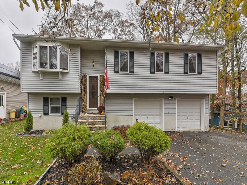 Not your average Hopatcong Bi-level! FLAT yard with NEWER septic, 4 large bedrooms, Master with walk-in closet and stunning renovated bath. Skylight in spare bath, lots of storage and large, wide driveway for all your parking and guest needs. Close to Lake Hopatcong to enjoy boating and fishing. *This neighborhood has an optional beach club on Lake Hopatcong (fee applies) with beach, dock slips, and club house. Ready for the most discerning buyer! Come see it today and close before the new lake season arrives!