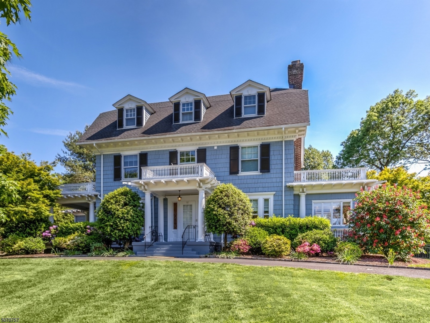 Rarely available for sale on prestigious Beekman Rd, this interior designed and totally updated beauty sits on .70 acres of mature landscaping with level, fenced rear yard. Lincoln Hubbard School. Easy walk to town/train. Highlights incl: grand foyer w/sweeping three-story open staircase, interior-designed living and dining rooms w/dramatic high windows, gourmet kitchen connecting huge family room to rear yard, spacious bedrooms/baths, two home offices, light-filled lower level possible in-law suite w/kitchenette & full bath, fireplaces, veranda/balconies, gleaming hardwood & radiant floors, generous recessed lighting & ceiling medallion. Newer roof, furnace, AC, & whole house generator. The grandeur of early 1900s architecture with the added convenience of modern amenities will make this your happy place.