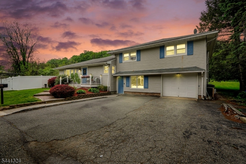 Nestled in desirable Pompton Lakes, this charming 4-bedroom split-level offers space, character, and great entertaining opportunities both inside and out. The open-concept main living area features soaring ceilings in the kitchen, exposed stone accents, a spacious living room with pocket doors, dining area, and cafe-style seating space filled with natural light. A first-floor bedroom and nearby full bath provide flexible living options. The lower level includes a welcoming family room with large picture window, laundry area, and home office. Upstairs offers 3 spacious bedrooms and a full main bath. Looking for extra fun space? "The cave"- Basement Retreat, is the perfect escape for game nights, hobbies, or relaxing. Enjoy the fenced-in backyard complete with deck and gazebo, lower patio, above-ground pool, and outdoor bar area made for entertaining. Conveniently located near Pompton Lakes' charming Main Street shops, restaurants, schools, parks, and NYC transportation. Seller will install a new roof for closing
