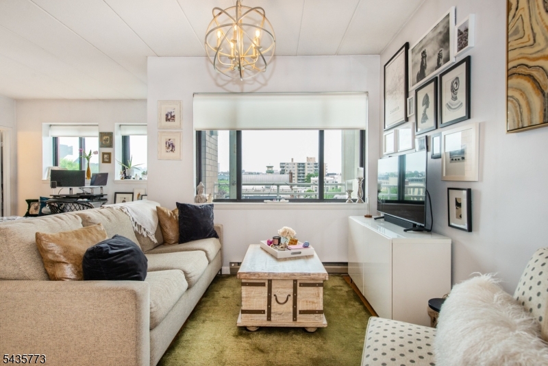 Welcome to this bright and inviting studio residence offering stunning New York City skyline views from a full-service elevator building in the heart of Hoboken. This well-maintained home features a private terrace, perfect for enjoying your morning coffee or unwinding while taking in the city lights. The updated kitchen offers modern finishes and functionality, while the assigned parking space provides a valuable convenience rarely found in such a prime location. The bathroom will be updated prior to tenant occupancy, providing a fresh and refreshed feel.Ideally located on Hoboken's highly sought-after 1st Street, near vibrant restaurants, shops, parks, and the waterfront, with convenient access to the PATH, NJ Transit trains, buses, Hudson-Bergen Light Rail, and NY Waterway Ferry for an easy commute.A rare opportunity to enjoy outdoor space, parking, skyline views, and exceptional convenience in one of Hoboken's most desirable locations.