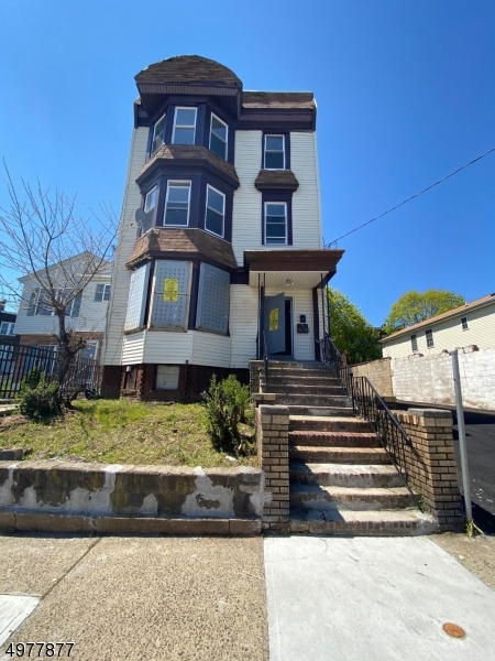 A rare opportunity to own a COMPLETELY RENOVATED THREE family home with SIXTEEN PARKING SPOTS!!! Each unit is over 1,400 sq ft and equipped with hard wood floors through out, 3 massive bedrooms, renovated kitchen, bathroom, living, dining and laundry room.